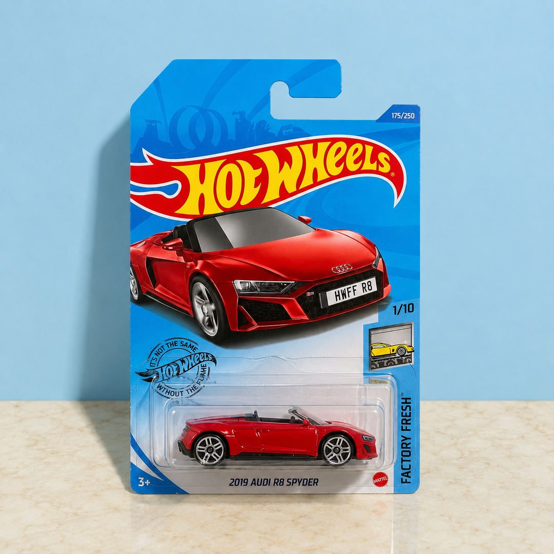Hot Wheels 2019 Audi R8 Spyder Factory Fresh red die-cast collectible car in original packaging on beige marble background