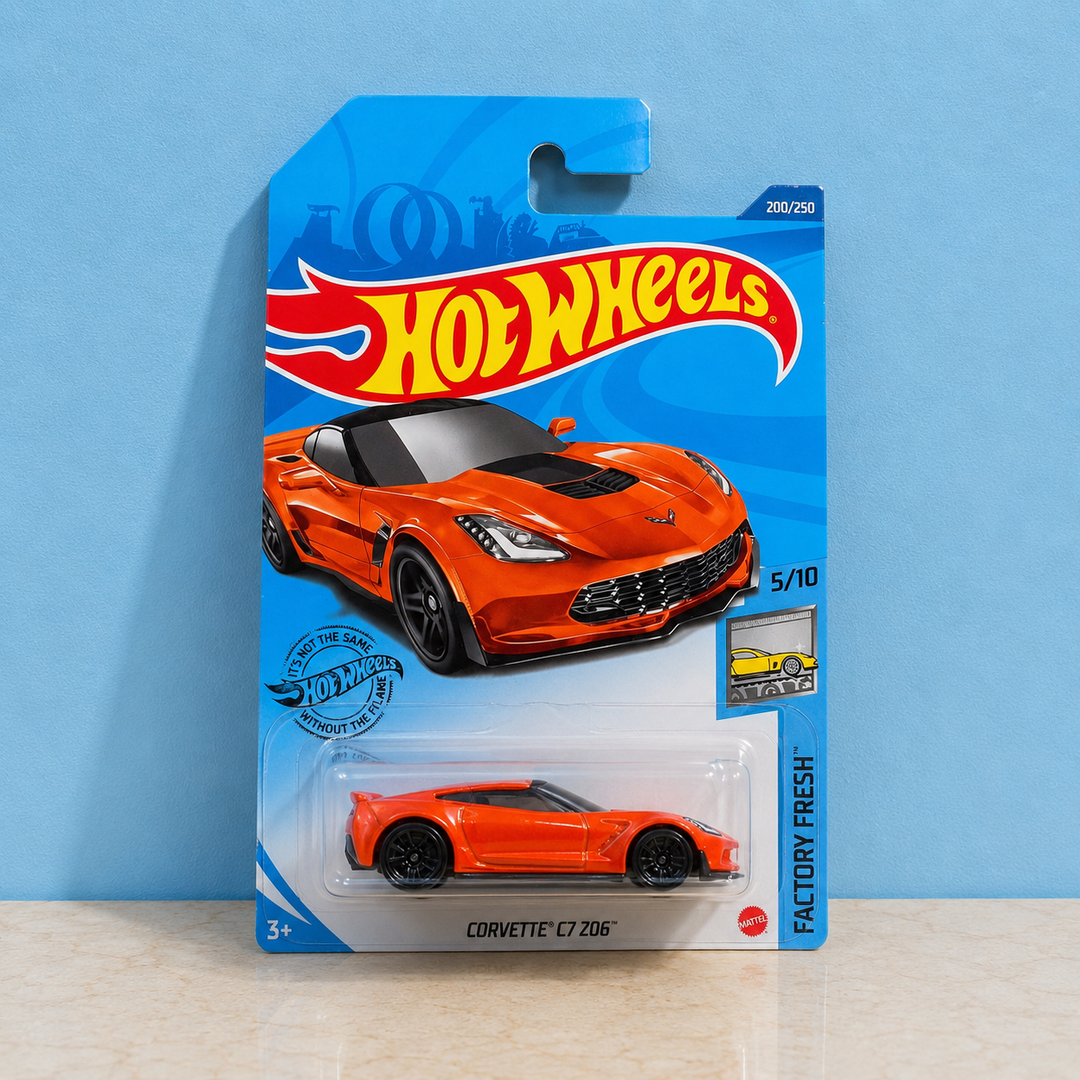 A Hot Wheels Corvette C7 206 die-cast toy car in its original blue blister card packaging,  1:64 die-cast car made in Malaysia